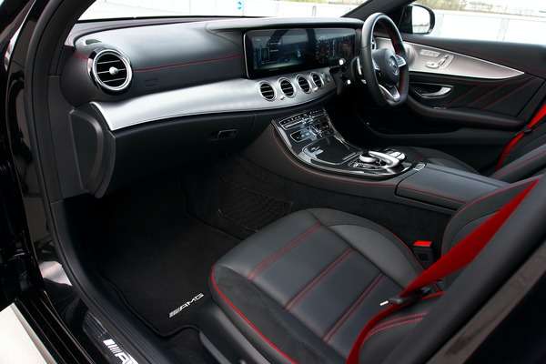 Mercedes luxury car interior with leather seats and wood trim